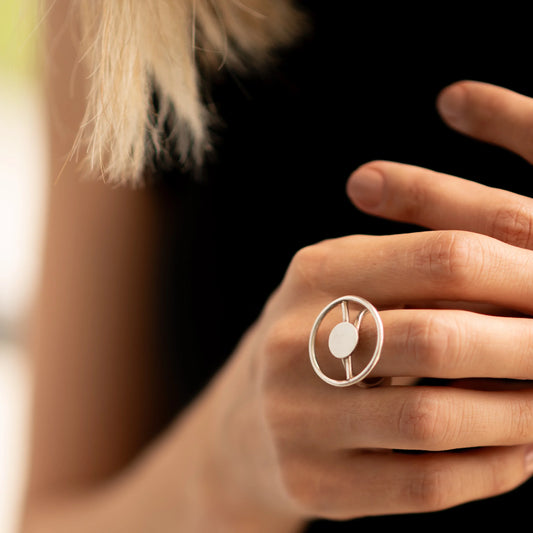 Silver 950 Eclipse ring with a modern circular design on a woman's finger.