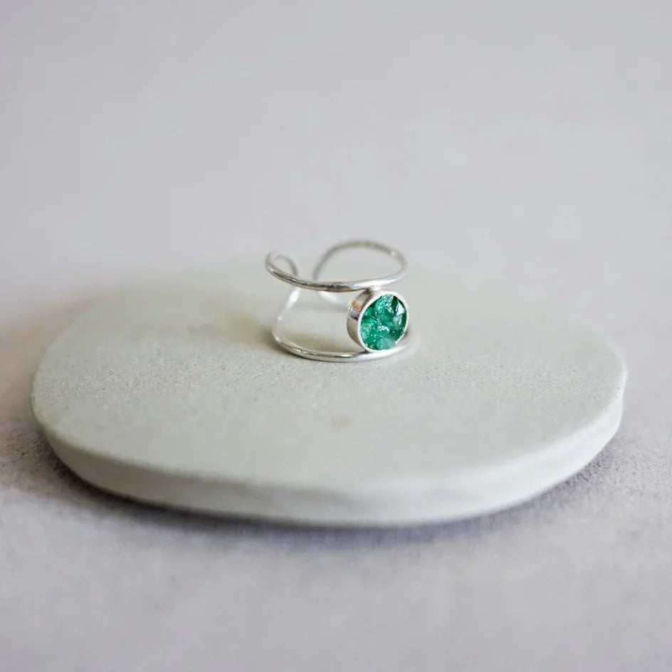 Silver 950 double band ring with a round, raw Colombian emerald gemstone.