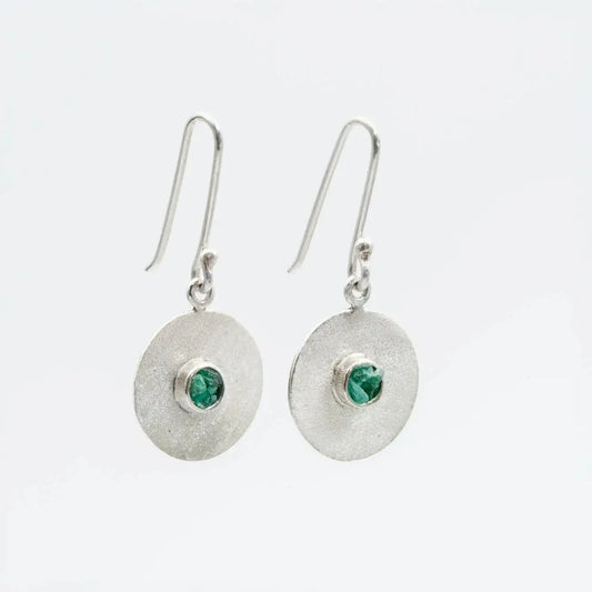 Handmade recycled silver disc earrings with raw Colombian emeralds.