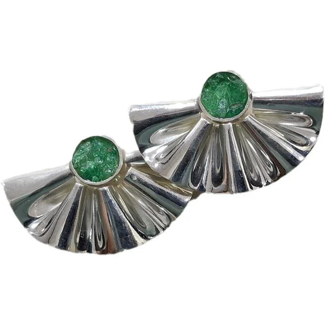Pair of silver fan-shaped earrings with rough Colombian emerald centers.