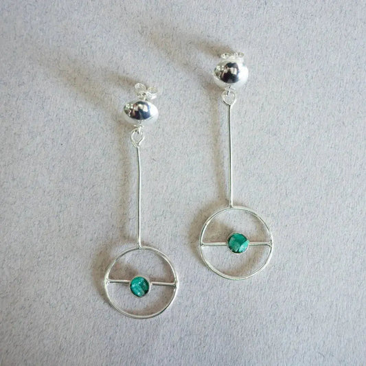 Silver 950 dangle earrings with a circular design and a Colombian emerald gemstone.