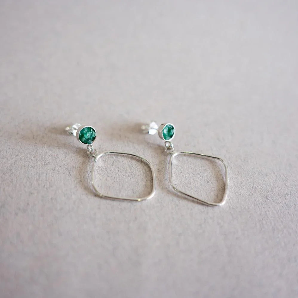 Handmade recycled 950 silver earrings with green Colombian emerald studs and dangling rhombus shapes.