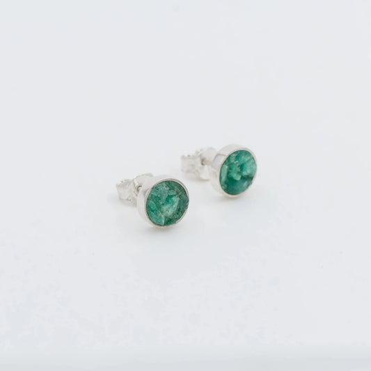 Handmade sterling silver stud earrings with raw Colombian emeralds.