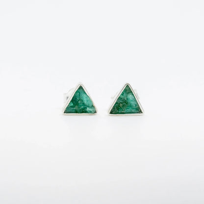 Handmade triangular silver stud earrings with raw Colombian emeralds.