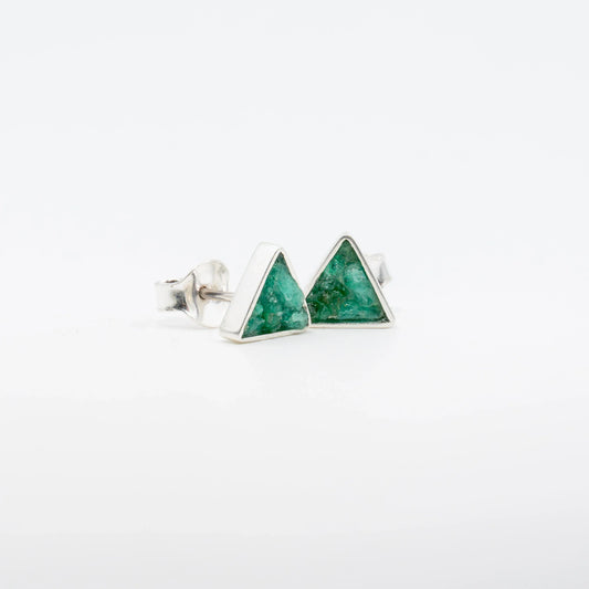 Silver triangle stud earrings with raw Colombian emeralds.