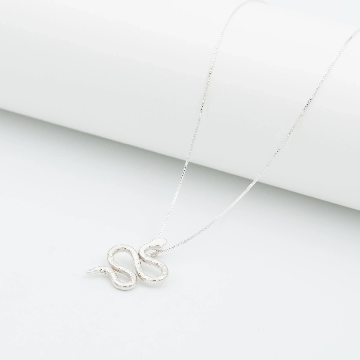 Silver 950 Mamba snake pendant necklace with a delicate chain on a white background.