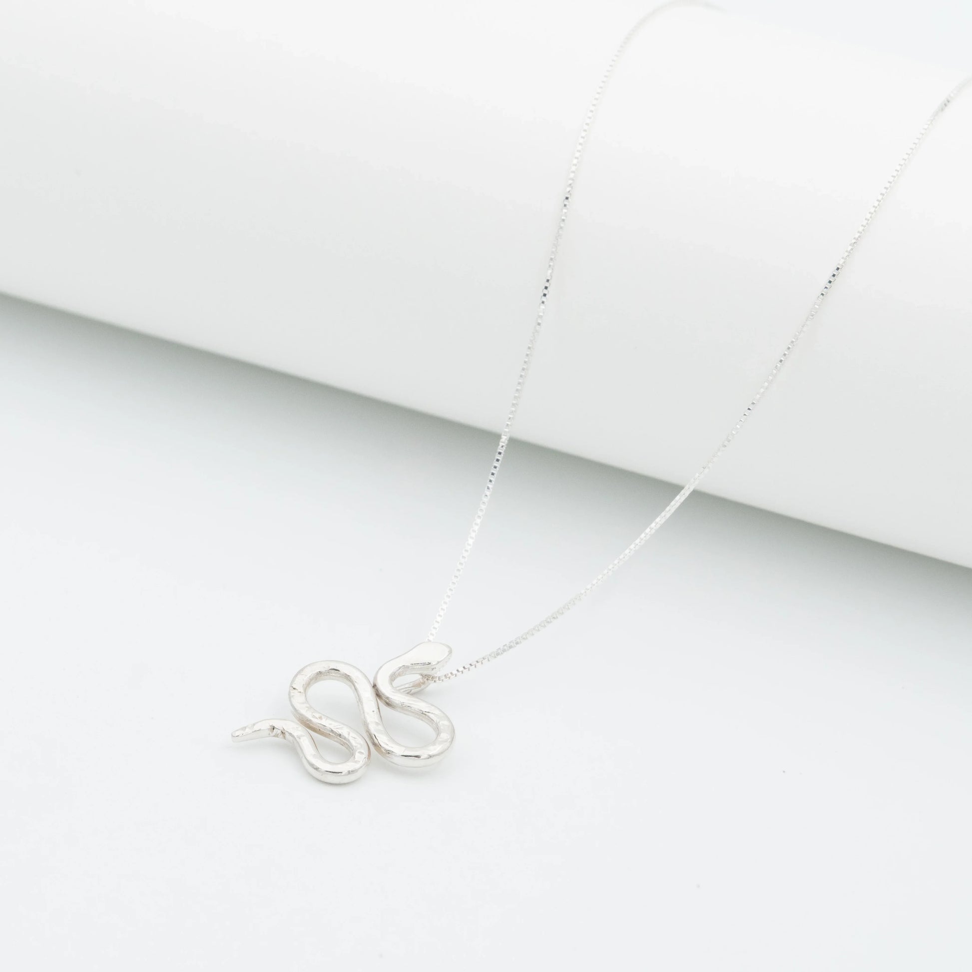 Silver 950 Mamba snake pendant necklace with a delicate chain on a white background.