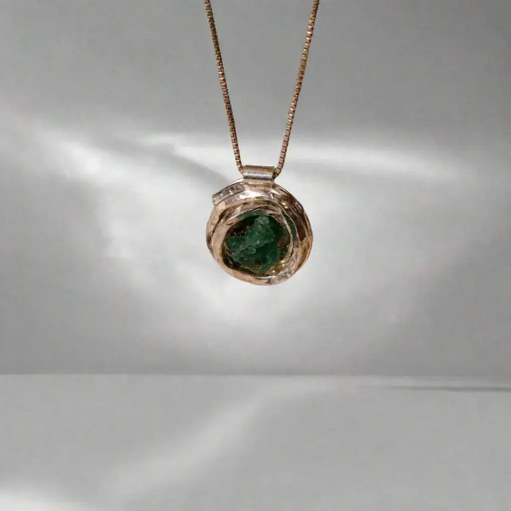 Handmade recycled silver 950 "nest" pendant with a raw Colombian emerald, on a delicate chain.