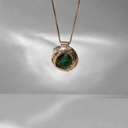 Handmade recycled silver 950 "nest" pendant with a raw Colombian emerald, on a delicate chain.