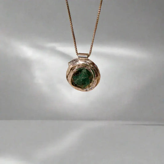 Handmade recycled silver 950 "nest" pendant with a raw Colombian emerald, on a delicate chain.