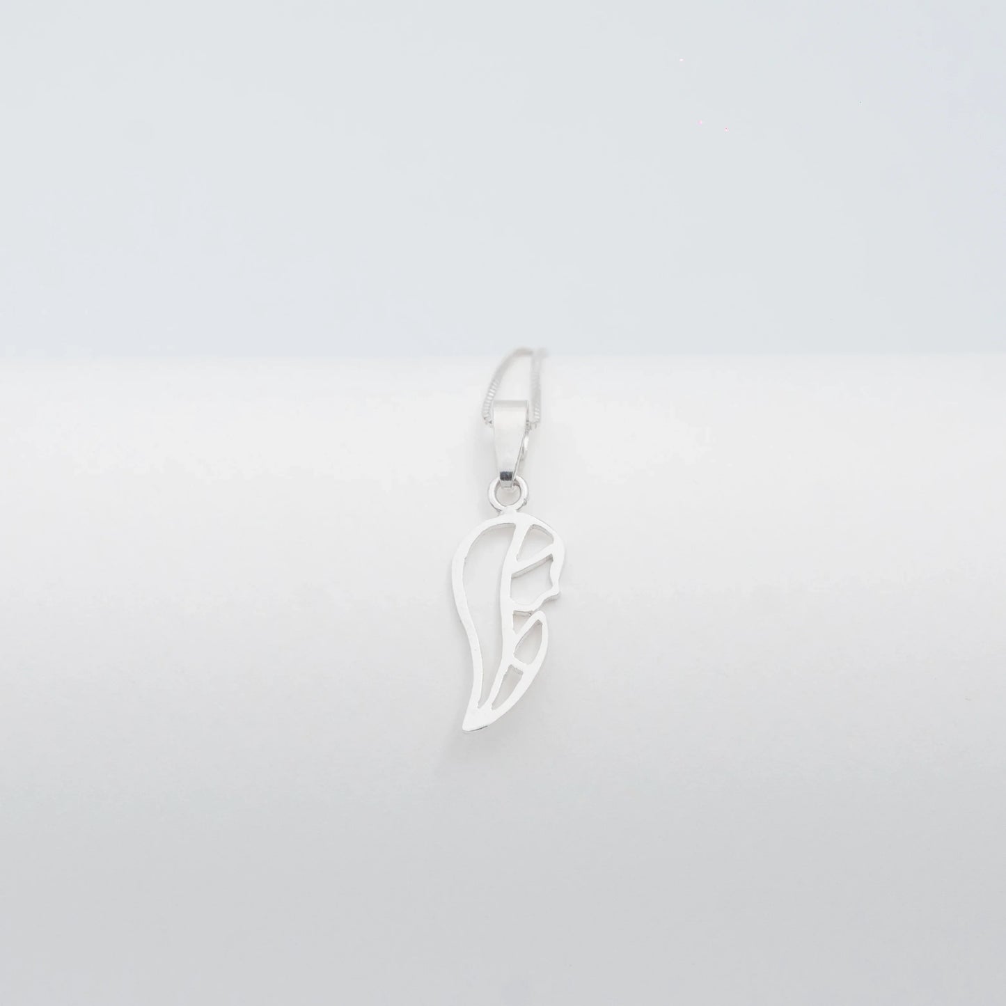 Silver 950 Virgin Mary silhouette pendant, handcrafted with a minimalist design.