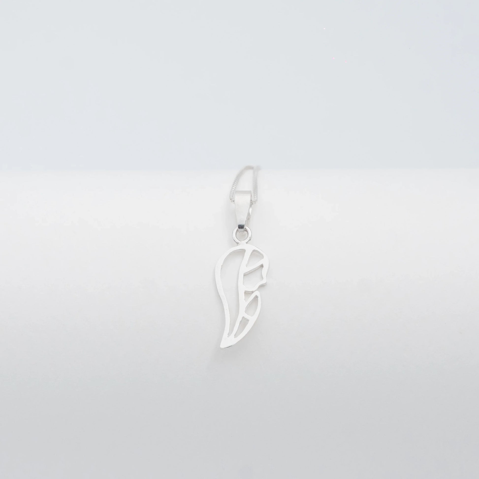 Silver 950 Virgin Mary silhouette pendant, handcrafted with a minimalist design.